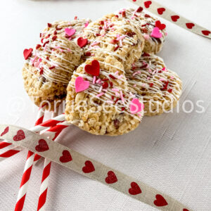 Strawberries and Cream Rice Cereal Treats Pops on Linen